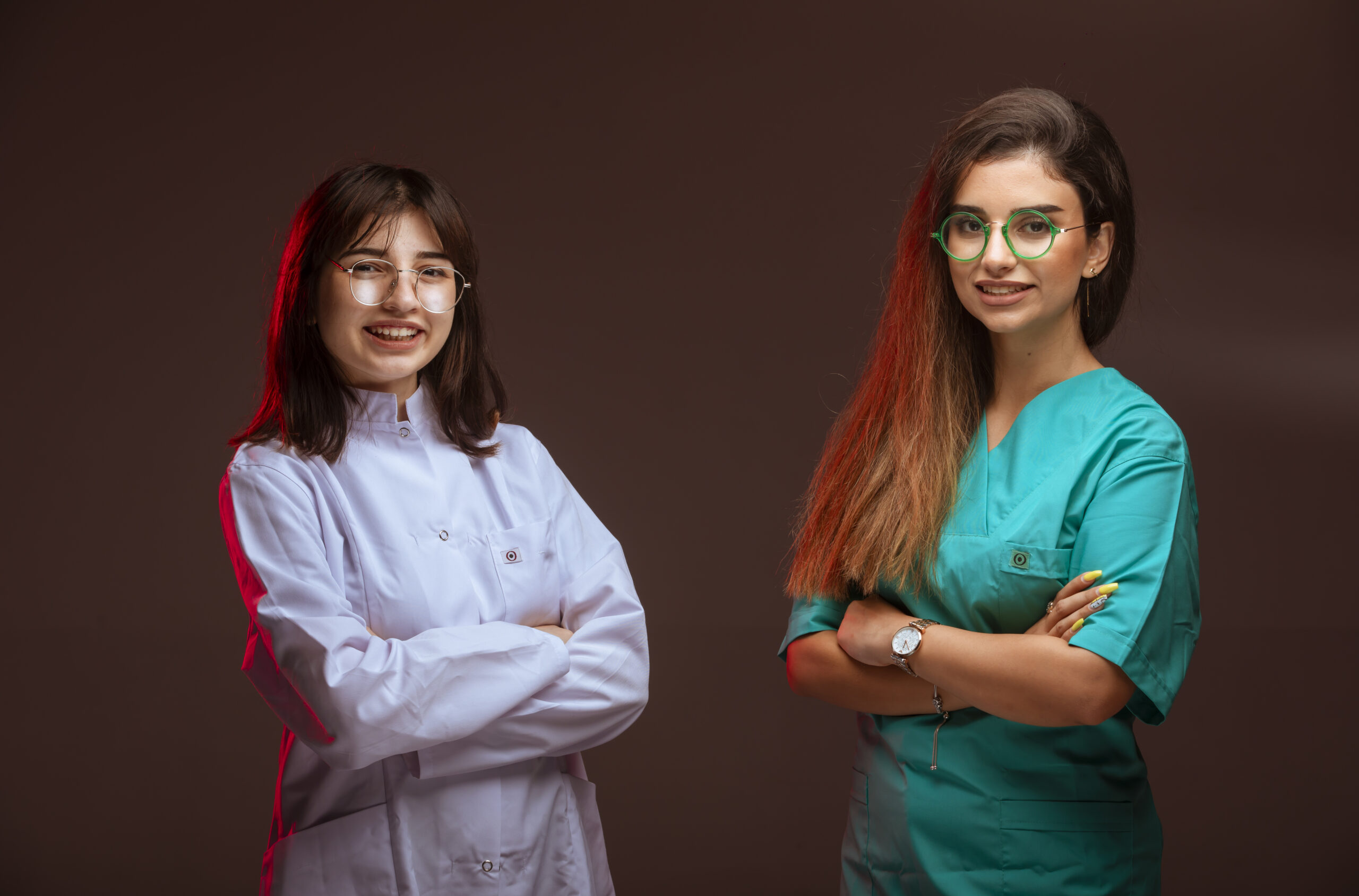 Female nurse and doctor look professional and smiling. High quality photo