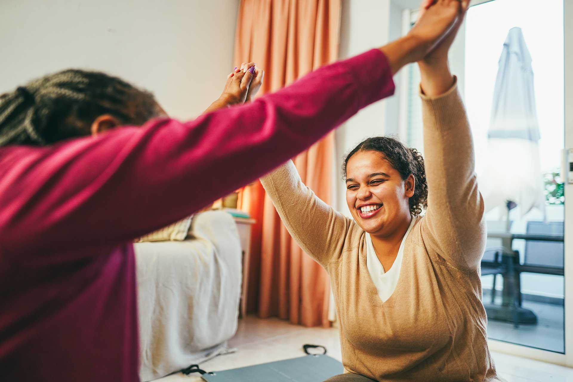 mother-and-daughter-doing-fitness-exercises-at-hom-NZTE9KS